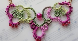crochet jewelry pink crochet necklace laying on music book CNRXBMH