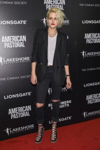 kristen stewart style kristen stewart opts for a tough look of distressed jeans and lace up heels GCKGTAD